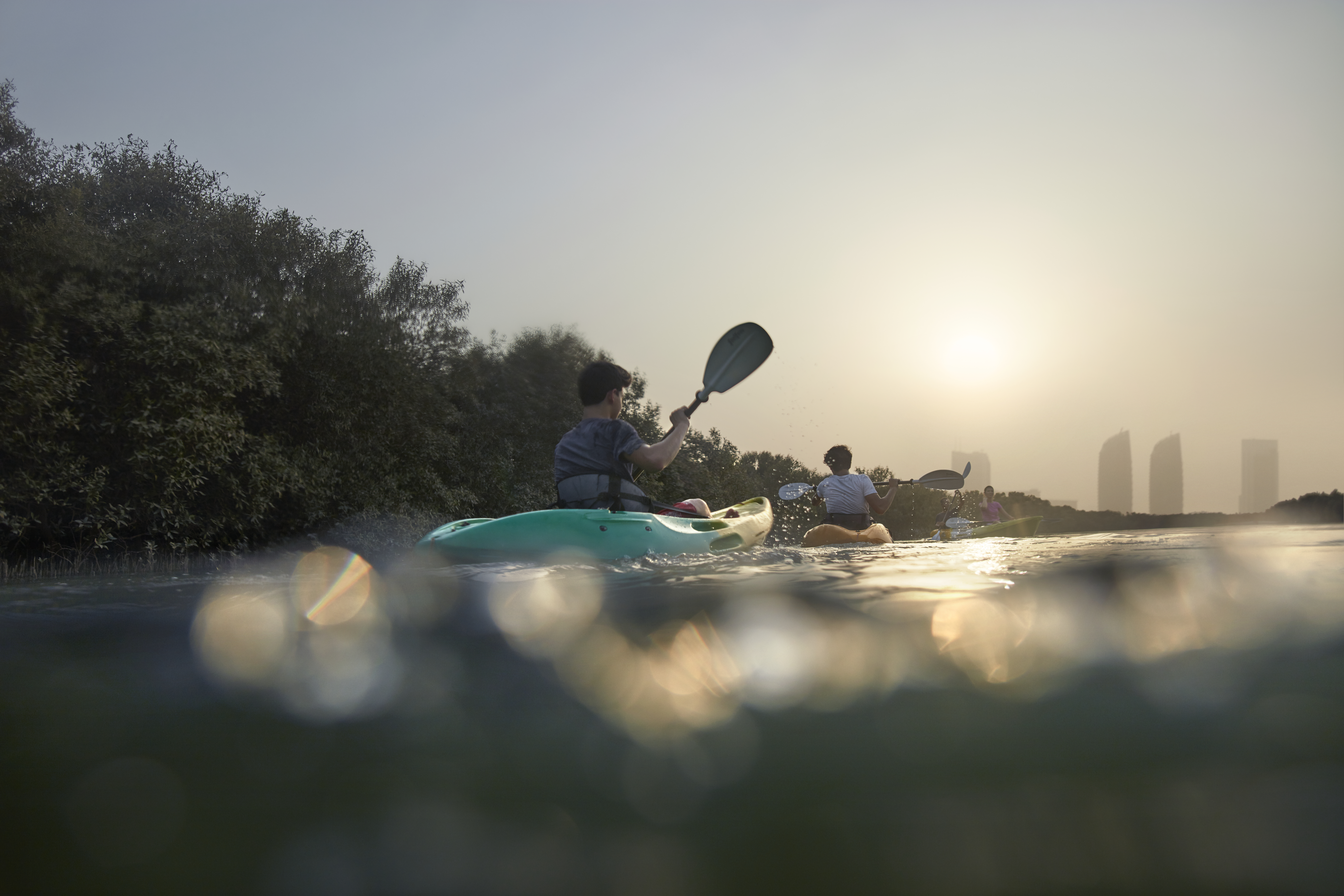 Men kayaking in the Abu Dhabi mangroves